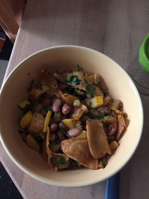 Pattypan fry up, like this one in Fine Cooking, except I added beans and used corn tortillas instead of chips.