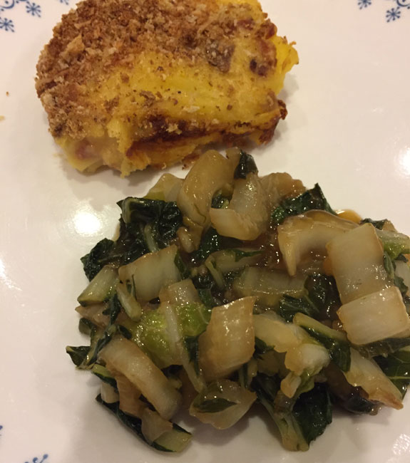 Cheesy scalloped potatoes with bacon and stirfry bok choy