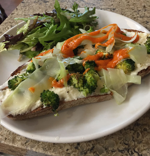 Roasted broccoli & goat cheese tartine at Floriole. The red stuff is a French-dressing-like vinaigrette that's a bit spicey. They shaved the broccoli stems & added them to the salad.